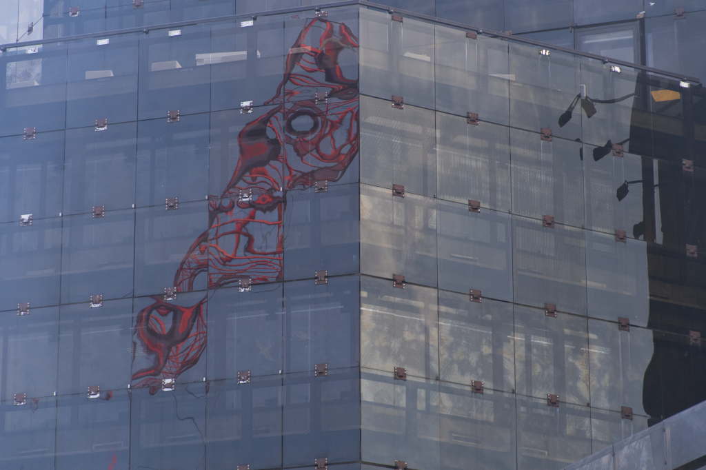 Abstract Crane Reflection on Glass Building